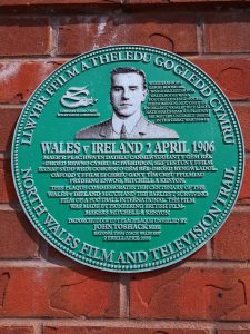 Plaque at Wrexham's Racecourse ground commemorating it as the location of the oldest surviving film footage of international football 